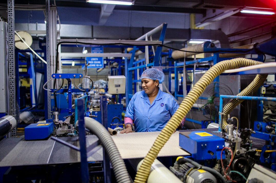 Factory worker operating machinery in an industrial plant