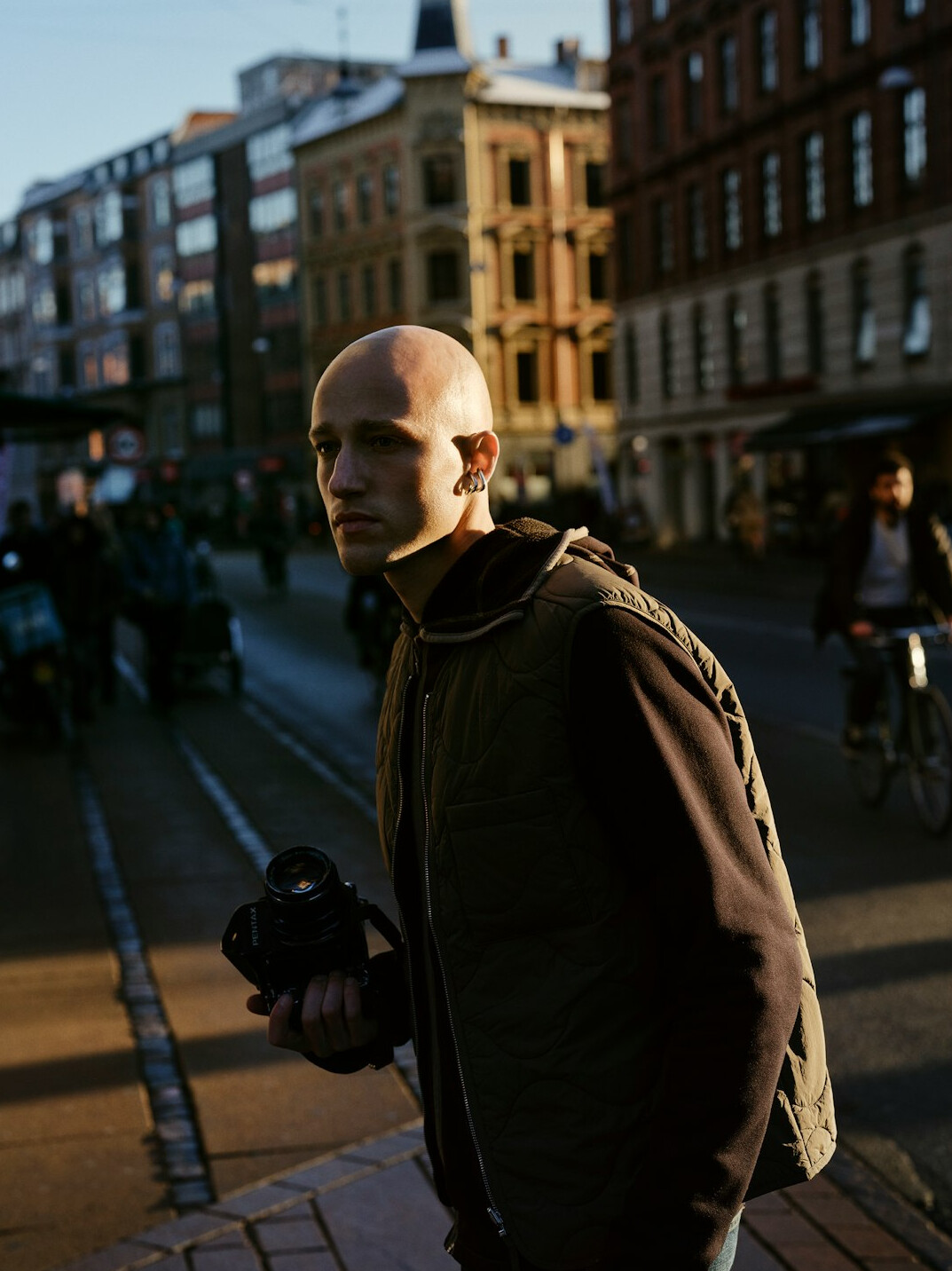 Portrait of a male documentary photographer with a camera